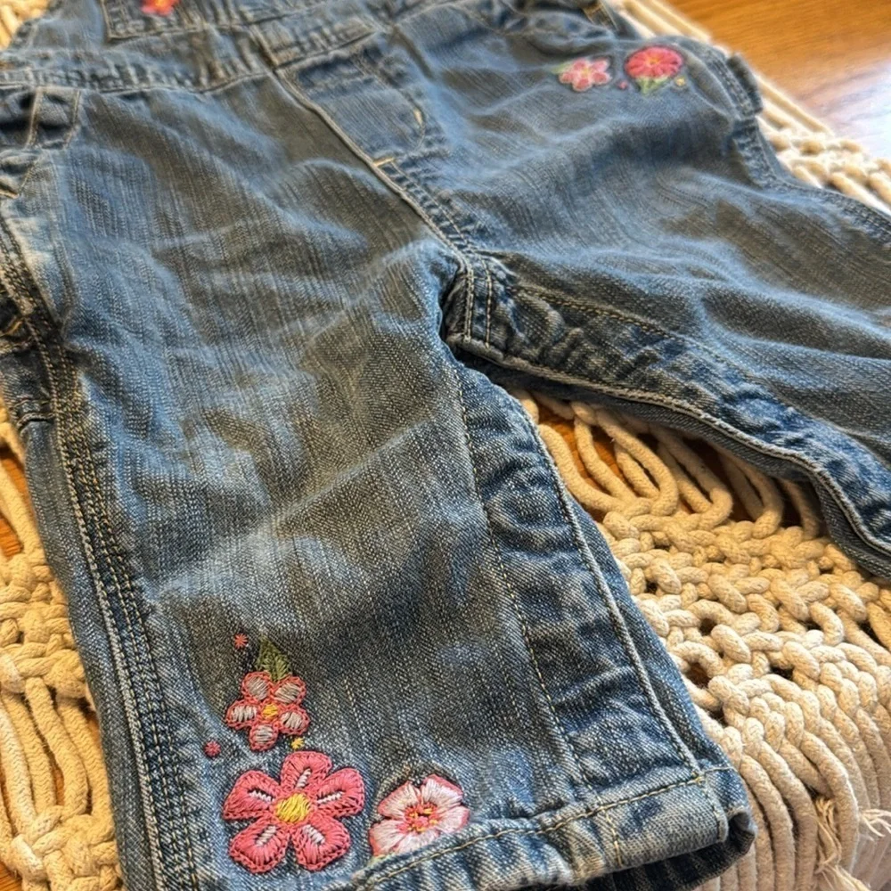 OshKosh B'gosh Blue Denim bib Overalls Embroidered pink flowers‎ size 6/9 months